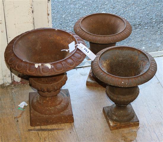 Three Victorian cast iron urns W.28 and 22cm
